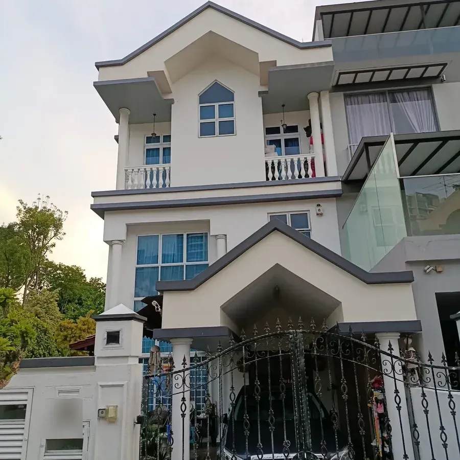 Completed exterior repaint, full-height view of a landed home
