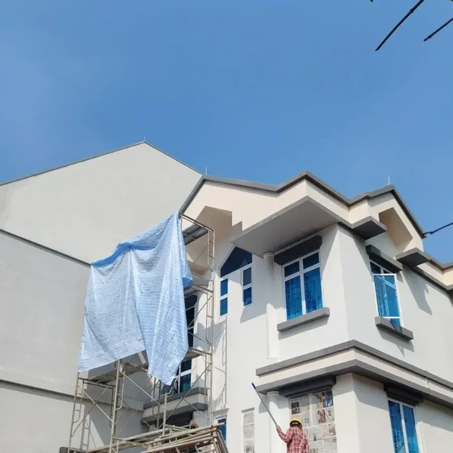 Tarp-protected facade during exterior painting works